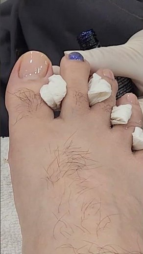 Guy getting his toenails painted