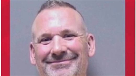 Texas sheriff smiles in mug shot after arrest and indictment
