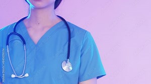 Woman paramedic. Emergency services. Thoughtful calm tired female nurse standing blue flashing lights urgent medicine pink background free space.