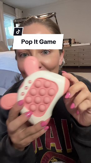 This fast push pop up game is such a hit with all ages! Stocking stuffer idea, perfect for long car rides, etc. The sound can be turned down or off and it has 4 ways to play including multiplayer. A fun secret santa or white elephant gift idea too! #fastpush #fastpushgame pop it game, games for kids #stockingstuffers #tiktokshop #tiktoktoy