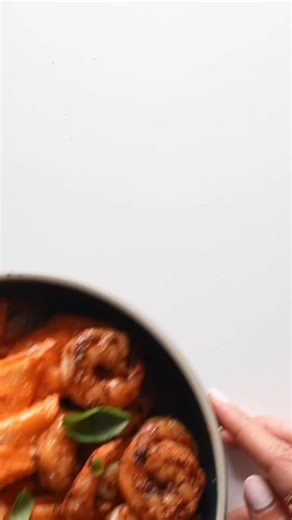 The pasta of summer! Caramelized shallots folded into a silky red pepper sauce, and tossed with noodles (and shrimp if you want!). Heaven! https://pyum.co/3Ga6WIY | Pinch of Yum