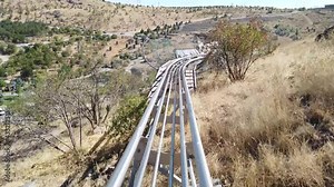 Summer toboggan run rodelbahn with many curves on a mountain
