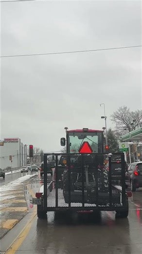 Tractor on trailer rolling around- is this legal?