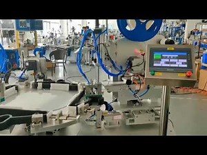 Automatic clothes hanger labeling strapping machine