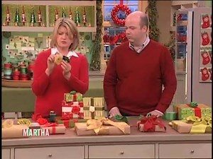 Martha Stewart creates beautiful roses out of ribbon—perfect to top off your holiday presents with! Check out three more unique ways to wrap a gift here: https://trib.al/cD6BUq2 | Martha Stewart