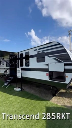 Meet the Transcend 285RKT — where comfort meets capability! With a class‑leading 17’ power awning, triple theater seating, and a spacious rear kitchen pantry, this floorplan is built for elevated camping comfort. Add in a 40x74 dinette and an outdoor kitchen, and you’ve got the perfect setup for long weekends or cross‑country treks. Come see why the 285RKT is sure to be a fan favorite! #GrandDesign #GDRV4Life #FloridaRVSuperShow #Transcend #traveltrailer | Grand Design RV