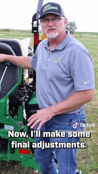 Setting up a John Deere 260B Backhoe attachment on a 1025R Tractor.