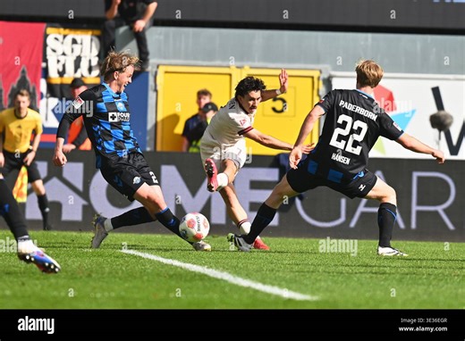 Paderborn, Germany. 21st Mar, 2026. Soccer, Men: Bundesliga 2, SC Paderborn 07 - Dynamo Dresden, Matchday 27, Home Deluxe Arena: Jason Ceka (M, Dynamo Dresden) shoots. Credit: Swen Pförtner/dpa - IMPORTANT NOTE: In accordance with the regulations of the DFL German Football League and the DFB German Football Association, it is prohibited to utilize or have utilized photographs taken in the stadium and/or of the match in the form of sequential images and/or video-like photo series./dpa/Alamy Live 