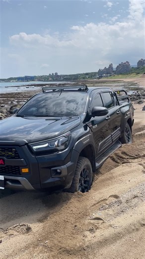 Toyota Hilux Off-Road Adventure in Sandy Terrain