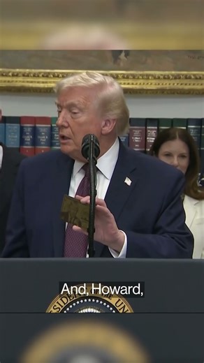 Trump shows off "Gold Card" visa