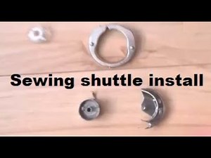 Sewing machine vertical shuttle install - placing back bobbin case hook race locking ring