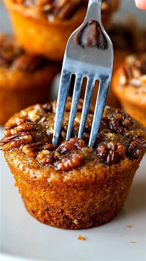 Pecan Pie Muffins Ingredients: - 1 cup chopped pecans - 1 cup packed brown sugar - 1/2 cup all-purpose flour - 2 large eggs - 1/2 cup unsalted butter, melted - 1/2 teaspoon vanilla extract - 1/4 teaspoon salt Directions: 1. Preheat your oven to 350°F (175°C) and grease a 12-cup muffin tin or line with paper liners. 2. In a large bowl, combine the chopped pecans, brown sugar, flour, and salt. Stir to mix well. 3. In a separate bowl, beat the eggs slightly, then add the melted butter and vanilla e
