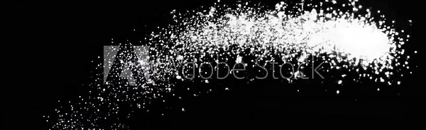 Sparkling white magic particles trailing across deep black background