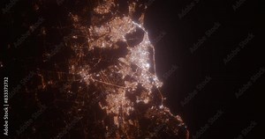 Natal (Brazil) aerial view at night. View on modern city from space. Camera is zooming in, rotating counterclockwise