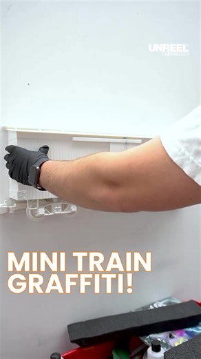 Transforming mini trains into graffiti masterpieces: An artistic adventure!