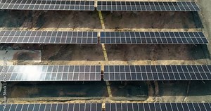 Harmony with Nature: Aerial View of Solar Panel Plant on Cyprus in Bright Sunlight, Demonstrating Eco-Friendly Electricity Production and Environmental Conservation. High quality 4k footage