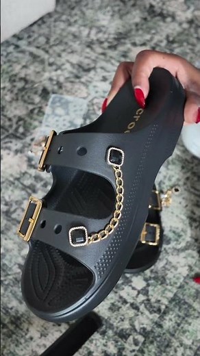 Crocs women’s two straps Saturday sandals are back in stock in the black and gold color! #Crocs