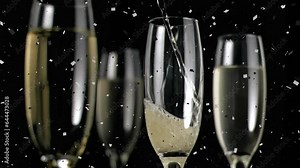 Animation of champagne pouring in glasses and confetti exploding against black background