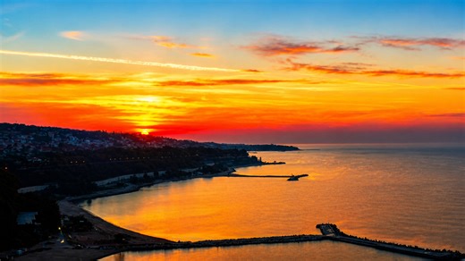 Scenic ocean sunset with vibrant orange sky