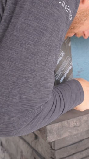 Simple corner miter detail for flashing the wainscot cap on our Westlake Royal Building Products Versetta stone. | RR Buildings