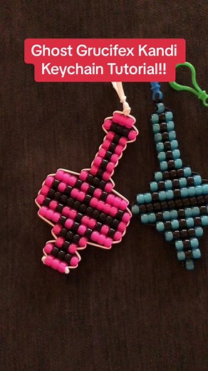 Its official here! The kandi keychain tutorial for your very own @thebandghost fan made grucifex!! Also i apologize for the audio not synching up at the end, im not sure what happened ! Here is the list of supplies and notes I have for making these!! The patterns are free and on my IG :) if you make any please tag me, i’d love to see! Supplies: -Keychain clasp or Keychain Ring -Plastic Lanyard Keychain string (type you weave boondoggle charms to) -Pony Beads -Drinking Straws OR toothpicks -Sciss