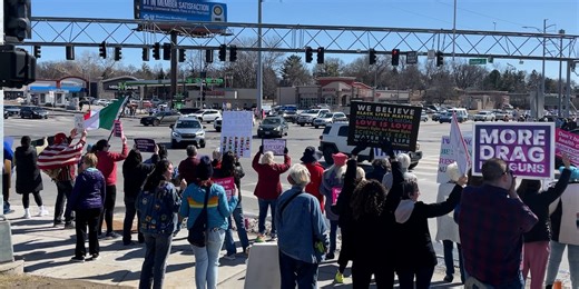Omaha residents protest Trump Administration, DOGE at busy intersection