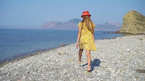 Cute little girl at beach during summer vacation
