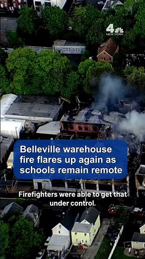 Belleville warehouse fire flares up again as schools remain remote | NBC New York