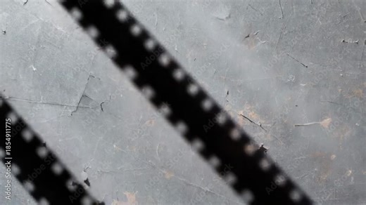 Aged 35mm Film Stock Macro Surface with Flickering Noise and Frame Jitter