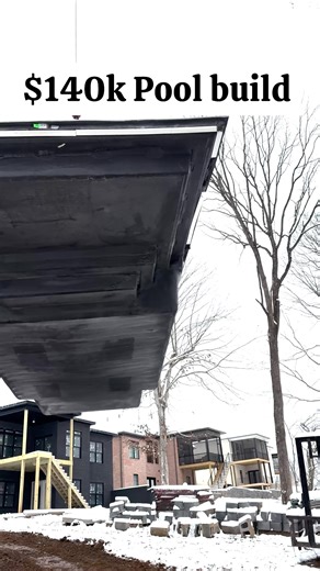 A $140K fiberglass pool shell is lifted by crane over a modern home—in snowy, muddy winter conditions. Crews guide the massive unit toward a pre-dug hole while text overlays capture the real-time vibe: “Alright, here we go,” “Snowy, winter out, and… set in the hole.” This isn’t just a build—it’s resilience, precision, and pro-level problem-solving on a tight timeline. Perfect for fans of high-end pool installs, extreme weather logistics, and behind-the-scenes contractor grit. 💪❄️ #fiberpool #lu