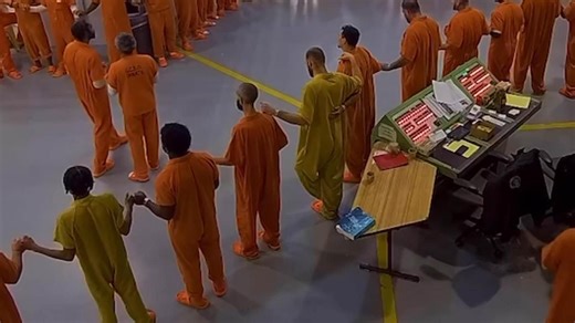 Inmates join together to say Lord's Prayer on Christmas Eve