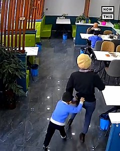 Close call: A trip to the restaurant turned into a lucky escape for this little boy — footage showed staff members rushing to push an enormous fridge off before it crushed him (warning: distressing) | NowThis
