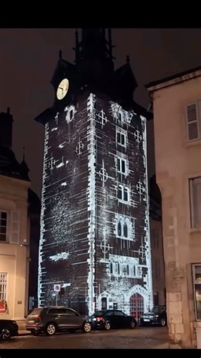 PMW Projection Mapping & New Media Arts on Instagram: "Beaune, France, turns its history into a living, breathing canvas. Laser projectors precisely align with the 15th-century stonework of the Tour de l’Horloge, animating its features to tell the story of the city’s past. The technology creates a seamless illusion of depth and motion, turning static stone into fluid art. From a tourism perspective, this is a brilliant strategy. It extends the economic life of the city into the night, transformi