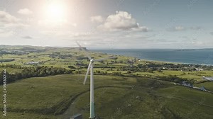 Windmill at solar station aerial. Port town at ocean bay. Nobody nature landscape. Alternative electricity. Environment protection. Manufactoring at Ballycastle pier, Northern Ireland, Europe