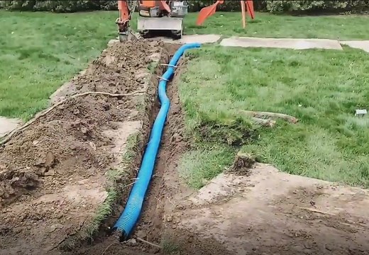 How to Bury Downspouts: Complete DIY Guide from the Pros