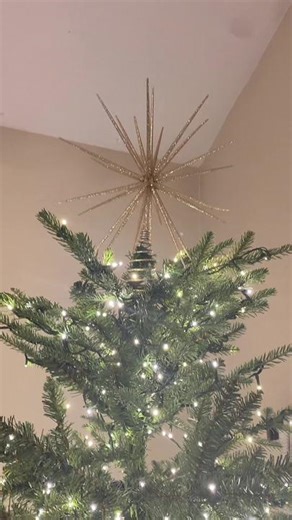 @crateandbarrel spiral star tree topper. Getting it done little by little. It has a spiral base and we learned how to get it to stay put by undoing the spiral and wrapping around the trunk of tree🎄✨#star #treetopper #christmas #christmastree