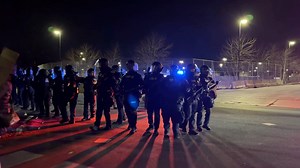 46K views · 947 reactions | NOW: “MOVE BACK…” Massive show of force here at the Whipple Building—Federal officers in riot gear come out to push the protesters back to the sidewalk. A guy driving by being heckled stops and gets out of his truck, a fight almost ensues. | Ali Bradley | Facebook
