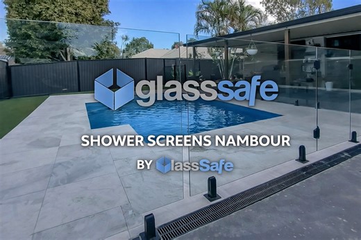 Glass fencing around a backyard pool