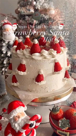 SANTA HAT CAKE🎅🏻 COMMENT ‘CAKE’ and I’ll DM you the recipe link! Follow @thelittleblogofvegan for the best vegan recipes! The BEST Vegan Santa Hat Cake - Layers of moist red velvet sponges with a whipped vanilla buttercream, strawberry jam, coconut decorated with fresh strawberry Santa hats! A fresh, sweet & fruity flavour, it’s absolutely delicious and perfect for Christmas! 🎂🍓Vegan, No-Egg, No-Dairy & festive!🎅🏻🎄 ——-> Get the recipe on my website: thelittleblogofvegan.com Type ‘Vegan Sa