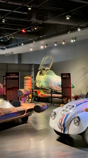 🚗✨ The Museum at Prairiefire is excited to debut Driven by Design: The STEAM Behind Pop Culture’s Iconic Rides — running Nov 24, 2025–Jan 15, 2026! Step inside an immersive world of full-size replica movie vehicles like the Ecto-1, Jurassic Park Jeep, Batmobile Tumbler, Star Wars Landspeeder, and the Top Gun: Maverick training cockpit — all crafted by KC Top Gears. Explore the STEAM science behind your favorite blockbuster rides with fun facts, hands-on highlights, and cinematic secrets the who