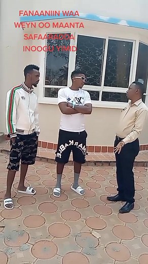 Engaging Conversation Outside a Cream Facade Building