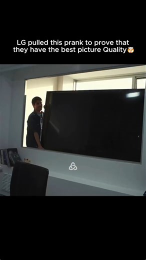 @olattoms on Instagram: "When Reality Was One Screen Away 🎥 LG didn’t brag about having the best picture quality; they weaponized it. In their now-legendary “Ultra Reality” prank, job candidates walked into a normal-looking interview room… and sat facing what they thought was a regular window. Then the sky fell. A meteor the size of a city block screamed in, exploded on impact, fire and debris everywhere. People dove under tables, screamed, one guy bolted straight for the door. Only after the p