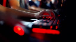 Close-up on a hand that uses a computer mouse and keyboard.