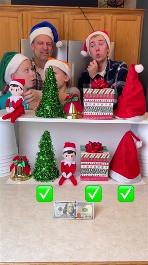 "Family Christmas Matching Game 🎁 Dad, kids, and the family play funny Christmas matching game with a golden bell, pine tree, elf on the shelf, present, and santa hat. Whoever matches them all correctly wins $100." 🎬 This video was produced by Network Media and Benson Bros | Play Together Stay Together