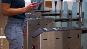 Access control systems in international airport. Validator. Checkpoint. Passenger Tapping Boarding Pass At Automated Self-boarding Gate Of An Airport. Stock Video