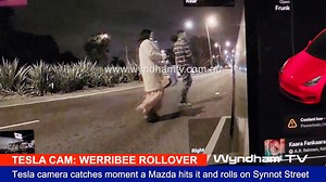 TESLA CAM CAPTURES DRAMATIC ROLLOVER IN WERRIBEE 07/06/2024 8.05pm This evening, just after 8pm, a dramatic crash occurred on Synnot Street in Werribee. Video footage captured the moment a silver Mazda sedan collided with a parked Tesla outside Dosa Hut and subsequently rolled onto its roof. A woman was believed to be trapped inside the overturned vehicle, prompting a swift response from emergency services. The cause of the collision, which led to the Mazda hitting the Tesla, is currently under 