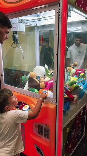 Claw Machine Fun: A Boy's Colorful Arcade Adventure
