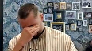 Barber shaves his head in solidarity with coworker