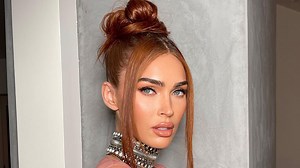 Megan Fox shows off her curves in see-through orange dress for sexy pics