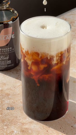 Iced Cold Foam Americano with NESCAFÉ Espresso Concentrate ☕️. This espresso concentrate will let you make your favorite espresso drinks at home in seconds, and you can customize it by mixing it with water like this recipe or with milk to make a latte. NESCAFÉ Espresso Concentrate is available in Black & Sweet Vanilla in-stores and online at @walmart ✨ Ingredients – 1 serving • sweetener, to taste [I used agave nectar] • 2 oz half & half • Ice • 10 oz water • 2 tbsp NESCAFÉ Espresso Concentrate 